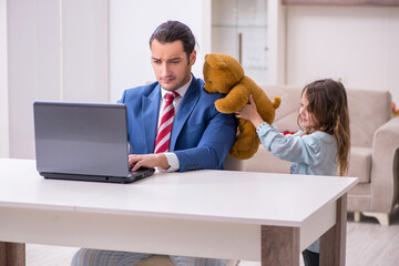 Girl bothering young father during working from house in pandemi