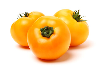 yellow tomatoes on white background.