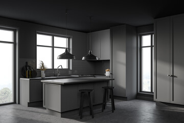 Gray kitchen corner with bar and stools