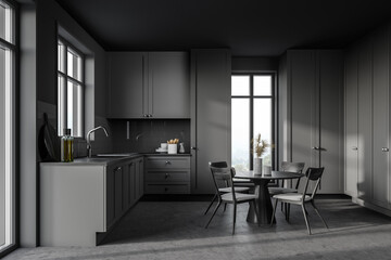 Gray kitchen interior with cupboards and table