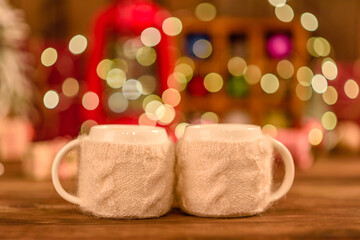 Beautiful multi-colored Christmas decorations on a wooden table with garlands and Christmas trees