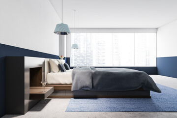White and blue bedroom interior, side view
