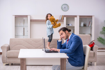 Girl bothering young father during working from house in pandemi
