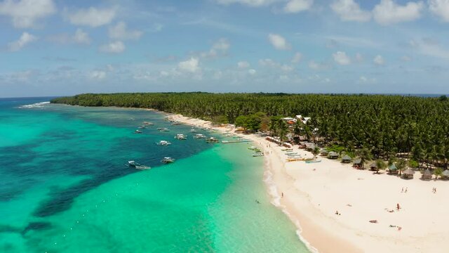 Tropical landscape: Daco island with beautiful beach, palm trees by turquoise water view from above. Siargao, Philippines. Summer and travel vacation concept