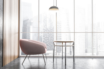 Pink chair with coffee table, near a big tall window with city view, office interior