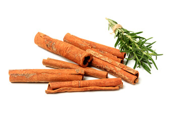  Cinnamon and rosemary on a white background