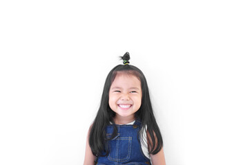 Asian child cute or kid girl and kindergarten student happy smile white teeth and beautiful milk tooth to new idea think with wear jeans at dental or pre school on white background with space isolated