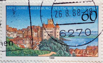 GERMANY - CIRCA 1988: a postage stamp from Germany, showing a view of Meersburg with Lake Constance in the background. 1000 years of Meersburg