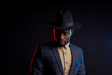 African american business man in black hat in studio