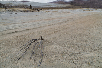 bad ecology, yellow river of chemical elements near the plant. dry yellow land without grass