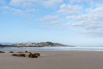 Fototapeta na wymiar wide and empty sandy beach on the coast of Cantabria in northern Spain
