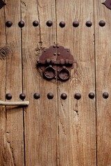 Chinese ancient door with metal handles and dotted decoration