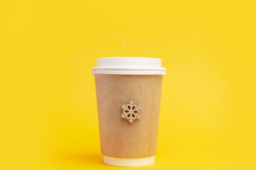 eco glass coffee to go with a snowflake on a bright yellow background