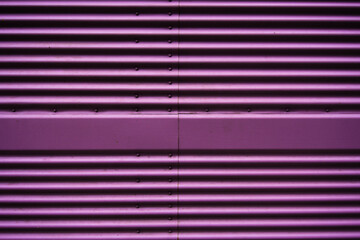 Abstract of a metal entrance in pink or purple colors