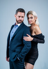 sexy couple in love. man embrace woman. formal couple. confident businessman with lady. business partners success. fashion and beauty. romantic relationship of guy and girl. Deep in love