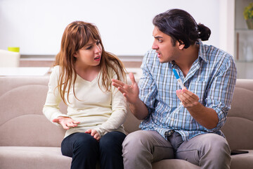 Young couple in unexpected pregnancy concept at home