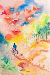Watercolor painting of a cyclist with Sun rising in the horizon, cloudy sky above and forest on the side of the village road. Indian watercolor painting made by brush and paint.