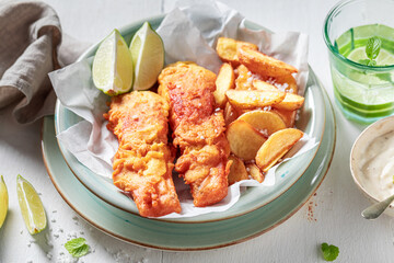Hot fries and cod served with lime and salt