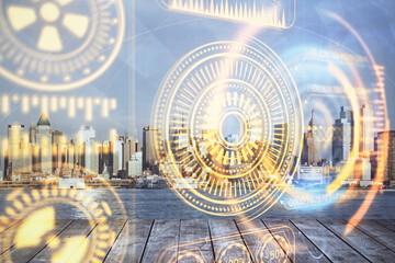 Double exposure of technology theme hologram and cityscape background. Concept of Hightech.