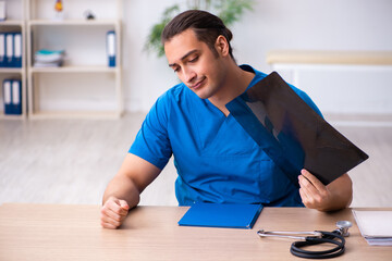Young male doctor radiologist working in the clinic