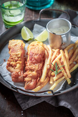 Hot fish and chips in white paper