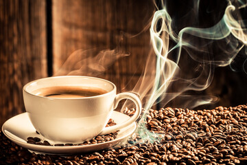 Roasted grains with smoke and white coffee cup