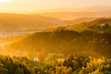 Warm Sunlight at Sunrise in Autumn. Polish Countryside Landscape at Fall Season