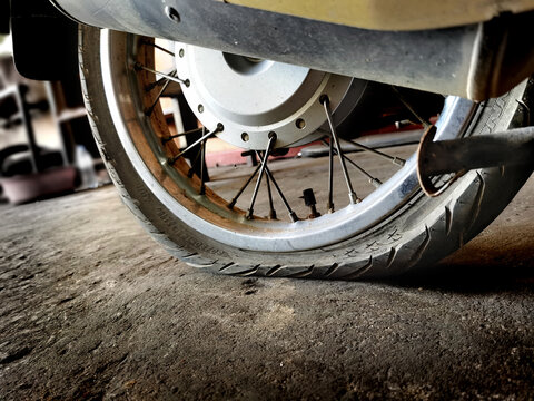 closeup Dirty wheel motorcycle flat tire Stock Photo | Adobe Stock