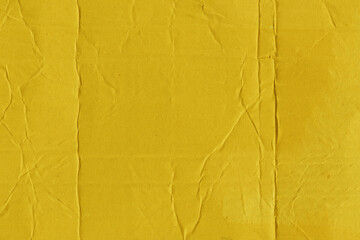 A yellow vintage rough sheet of carton. Recycled environmentally friendly cardboard paper texture. Simple and bright minimalist papercraft background.