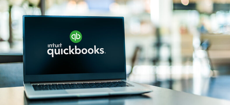 Laptop computer displaying logo of QuickBooks