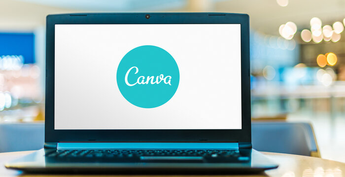 Laptop computer displaying logo of Canva