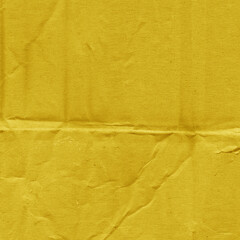 A yellow vintage rough sheet of carton. Recycled environmentally friendly cardboard paper texture....