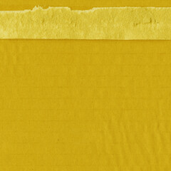 A yellow vintage rough sheet of carton. Recycled environmentally friendly cardboard paper texture. Simple and bright minimalist papercraft background.