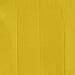 Fototapeta premium A yellow vintage rough sheet of carton. Recycled environmentally friendly cardboard paper texture. Simple and bright minimalist papercraft background.