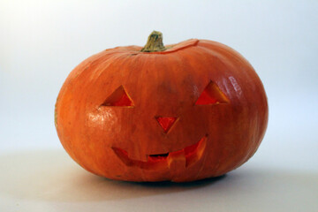 Halloween carved pumpkin on white background