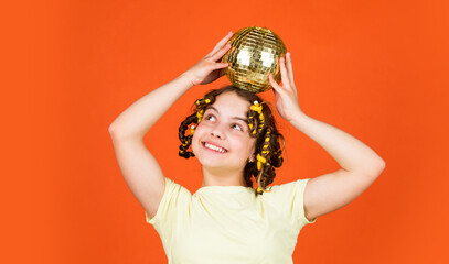 Retro party. Child hold golden disco ball. Cheerful girl with disco ball. Fashion kid posing with...
