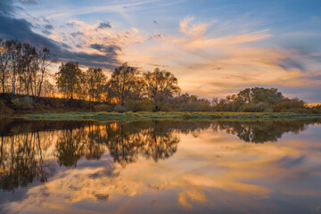 Autumn sunrise over the river in Moscow Region, Russia