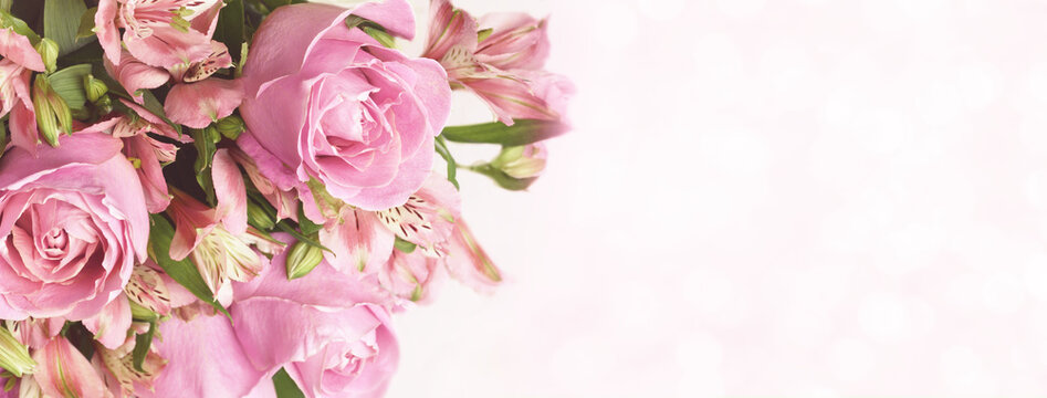Beautiful pink rose and alstroemeria flowers in a bouquet on soft bokeh