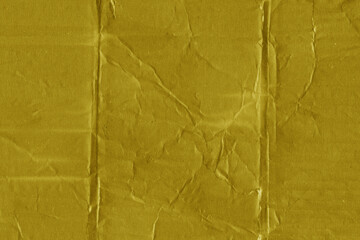 A yellow vintage rough sheet of carton. Recycled environmentally friendly cardboard paper texture....