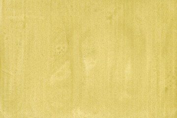 A yellow vintage rough sheet of carton. Recycled environmentally friendly cardboard paper texture. Simple and bright minimalist papercraft background.
