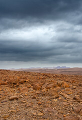 Deserted rocky plateau under a stormy sky.