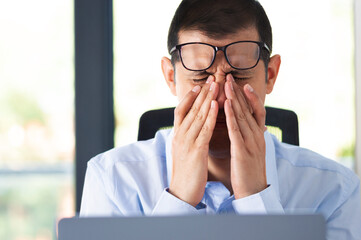 Office worker complaining suffering eyestrain at work