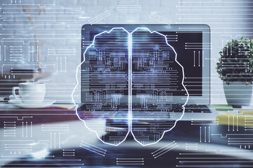 Double exposure of work space with computer and human brain drawing hologram. Brainstorm concept.