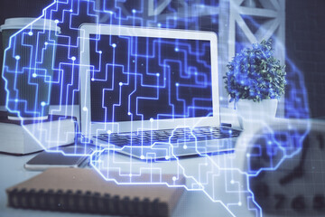 Double exposure of work space with computer and human brain drawing hologram. Brainstorm concept.
