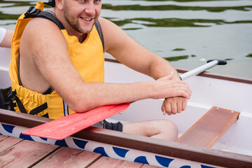 People with disabilities sail on a rowing boat.