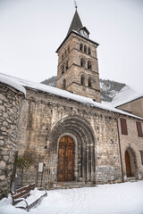 Bell tower in the snowy Arties, in the Spanish Pyrenees, Catalonia, Spain