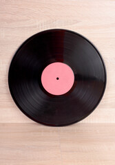 Vintage vinyl discs on wooden background