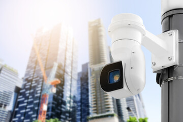 Modern public CCTV camera on electric pole with blur building background. Recording cameras for...