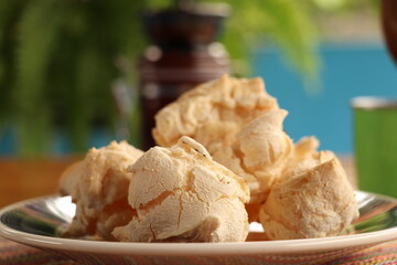 Breakfast, with starch biscuit, cheese bread, served on a wooden table outdoors. Farm breakfast....