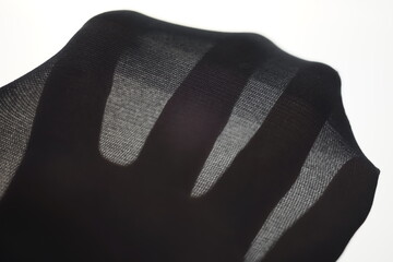 new black tights on a woman's hand with spread fingers